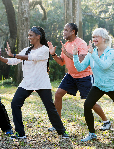 Five individuals practicing tai chi